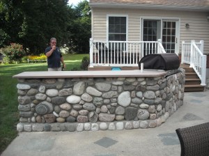 This shows a template created to size a black walnut cut for this outdoor bar top.